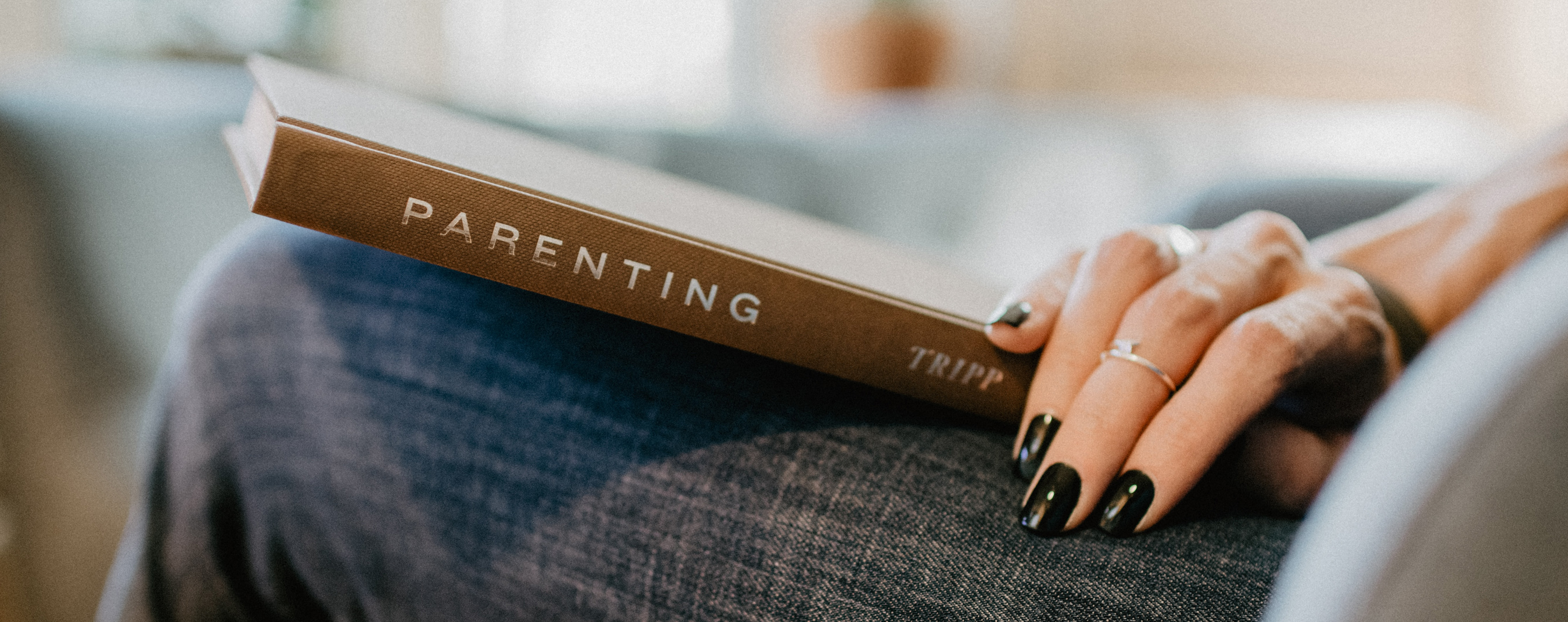 Image of a parenting book in a person's lap